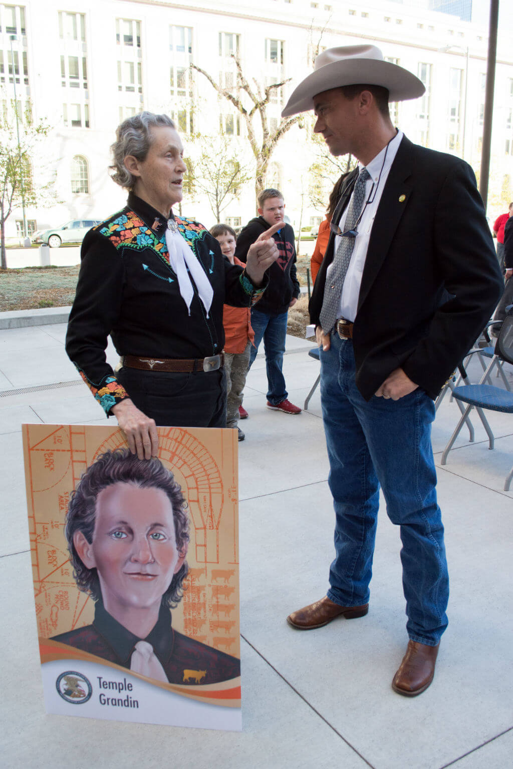 Image: Grandin with her USPTO inventor trading card, presented to her in 2016 at the USPTO Rocky Mountain Regional Office in Denver, Colorado.