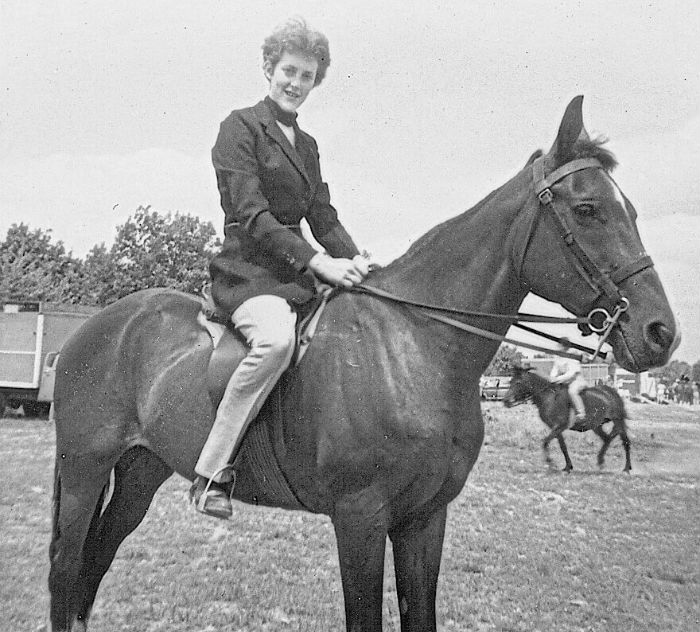 Image: Black and white photo of Temple Grandin on horseback as a teen.