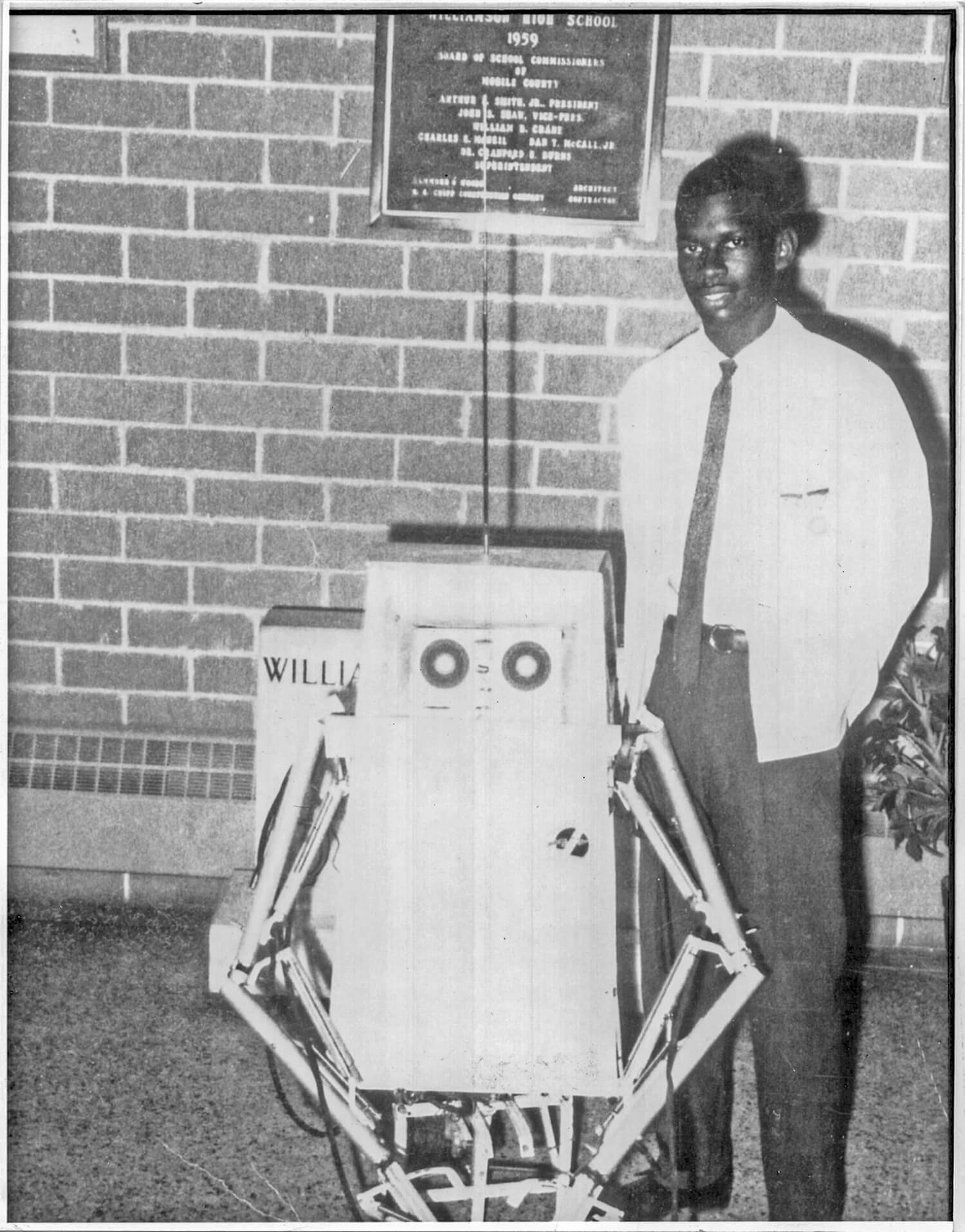 Image: Lonnie Johnson with the robot he built in high school