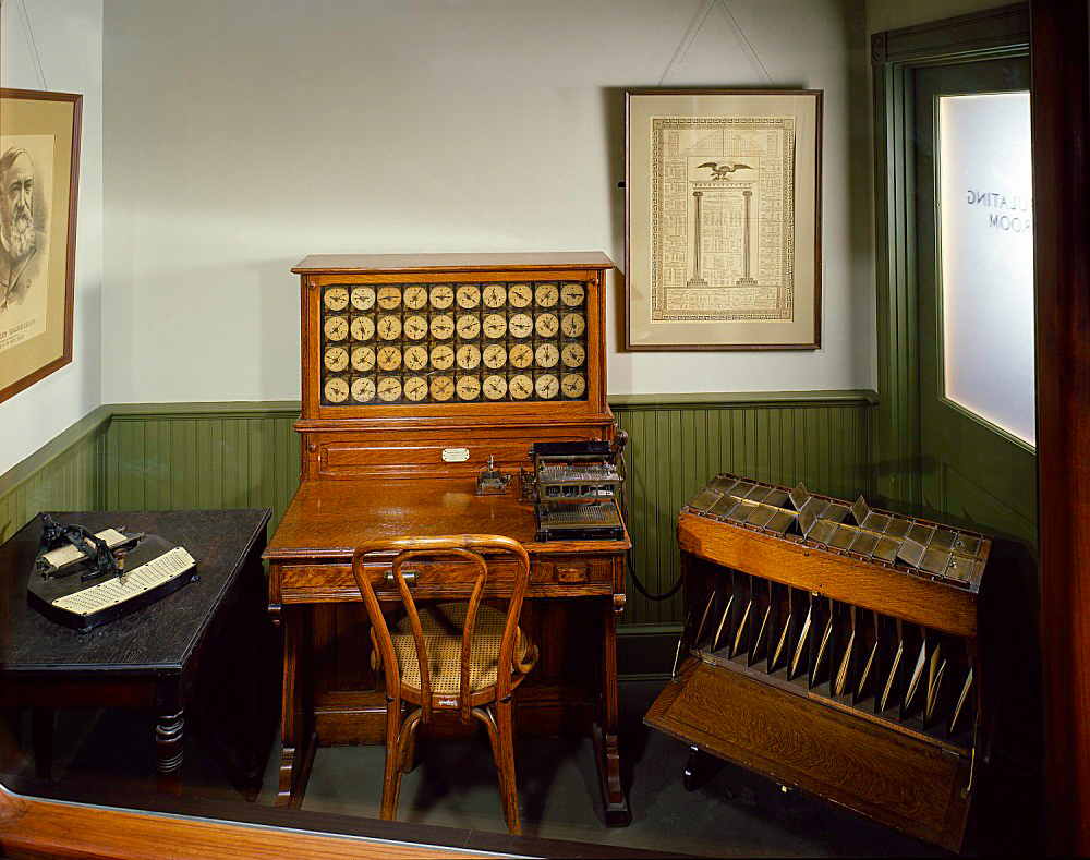 Museum exhibit of a Hollerith card puncher, tabulator, and sorting box