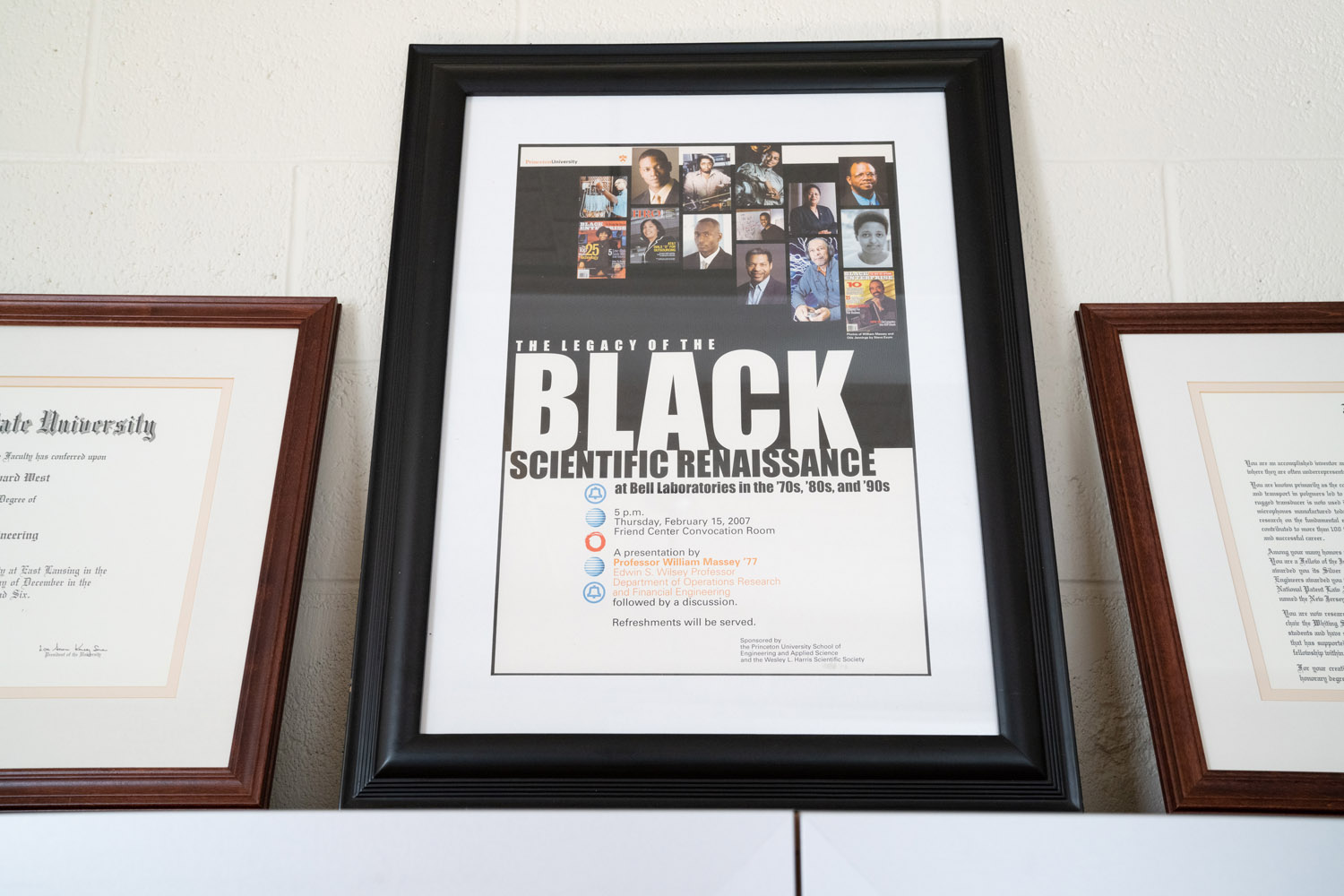 A framed announcement of an event in which Jim West was honored.