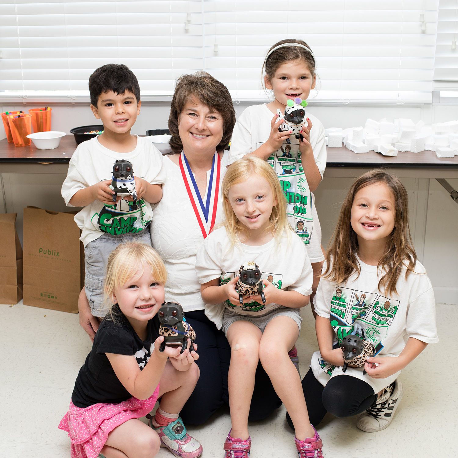 Jackie Quinn poses with Camp Invention kids