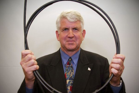Bob Metcalfe holding an Ethernet cable