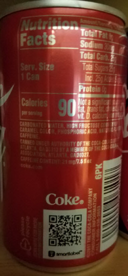 可乐样本显示了软饮料的商标用途。标本是一罐可乐的照片。商标显示在二维码上方。 