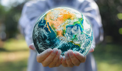 Close up of a person's holding an earth globe