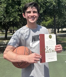 Travis Edwards with a basketball and his patent