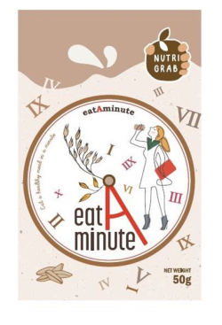 A hand grasping an apple with the words “NUTRIGRAB” on it. In the center is a circular clock with a drawing of a girl drinking juice and the words “eat A minute” at the bottom. The red minute and second hands form the letter “A.” The text “Eat a healthy meal in a minute” appears in cursive along the left edge of the clock.