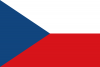  捷克共和国国旗，为水平双色旗，白色和深红色条带相等，升旗处为皇家蓝色等边三角形。